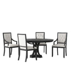 Dining room setup with a black round table and four chairs in a modern interior setting.