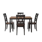 Dining room set with a table and four chairs in a well-lit room.