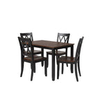Dining room with a dark wood table and chairs on a gray rug.