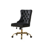 Black office chair with gold accents in a home office setting